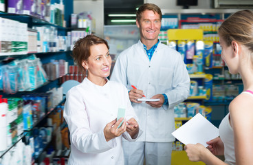 Fototapeta na wymiar Portrait of smiling man and woman pharmacists