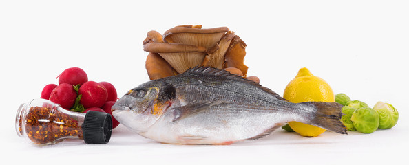 dorado fish, radishes, eggs, spices and brussels sprouts isolated on white background