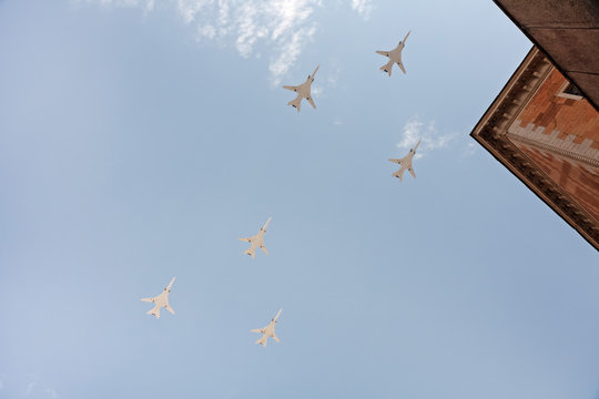 Tupolev Tu-22M3 (Backfire) supersonic swing-wing long-range strategic and maritime strike bombers flly over building