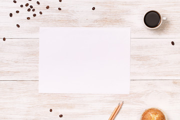 Coffee and biscuit in the white wooden table.  Banner space for text.