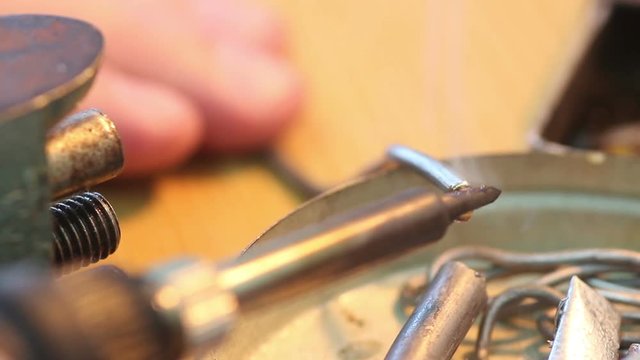 Melting solder wire on soldering iron tip