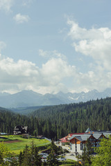 Guest house in the traditional mountain style and mountain landscape.