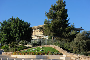 Fototapeta na wymiar Building of the Knesset, trees and flowers in the center of Jerusalem.