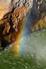 Rainbow in water spray,  Augrabies Falls National Park, South Africa.