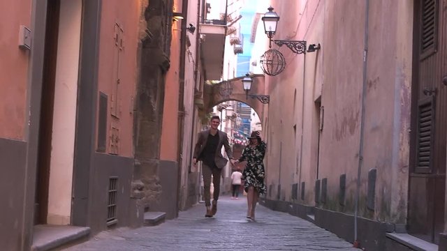 couple running on the old streets.