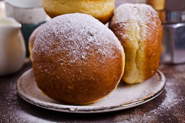 Traditional donuts with powdered sugar