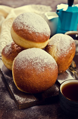 Traditional donuts with powdered sugar