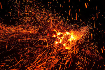 Fototapeta na wymiar live-coals burning in a barbecue