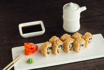 Japanese sushi with eel on a white plate