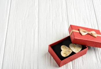Gift by Valentine's Day in a red box on a white background. Copy space.