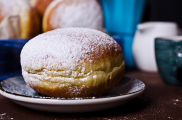 Traditional donuts with powdered sugar