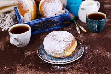 Traditional donuts with powdered sugar