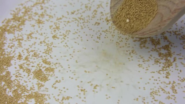 Amaranth being popped in a withe pan close up