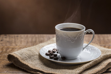 Cup of Coffee with Smoke/ Cup of Steamy Coffee with smoke on wooden table