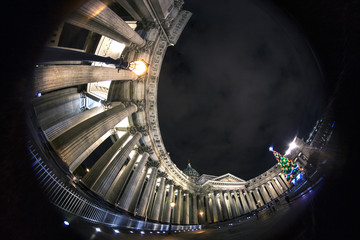 Kazan Cathedral ( Kazanskiy Kafedralniy Sobor) Russia, Saint-Petersburg, Nevskiy Prospekt, Winter evening. Fish eye wide angle image. Christmas decorations on the fur.