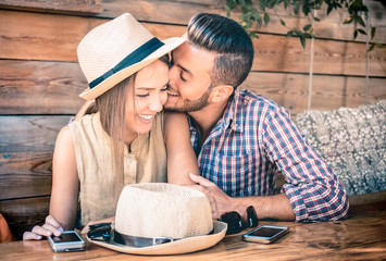 Young fashion couple of lovers at beginning of love story - Handsome man whispers sexy kisses in...