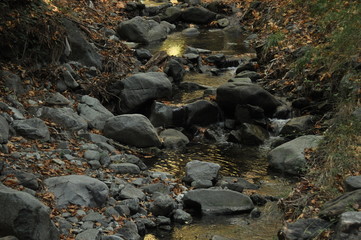 Hiking trail along the river to the waterfall Millomeris, in the mountains in Cyprus