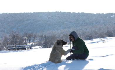 Hiker in winter in mountains