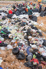 People collect gabage from  Removal and landfill waste from indu