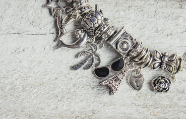 bracelet with pendants charms on the summer theme. Selective focus. 