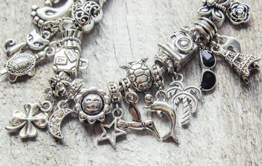bracelet with pendants charms on the summer theme. Selective focus.  