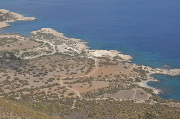 Fototapeta na wymiar Akamas National Park in Cyprus. View from the mountains to the blue lagoon and the crystal clear water