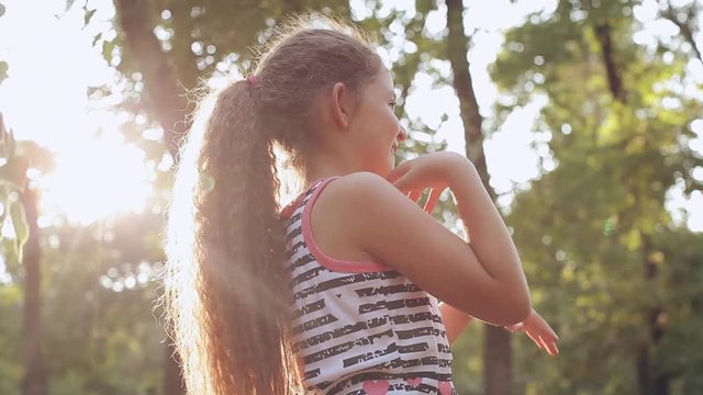 boy and girl blowing bubbles in the park