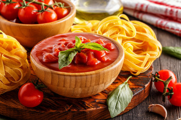 Products for cooking - tomato sauce, pasta, tomatoes, garlic.