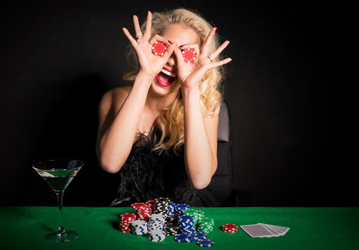 Woman making funny face with poker chips