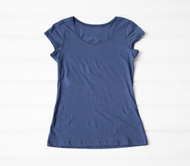 Blue women's t-shirt on the floor