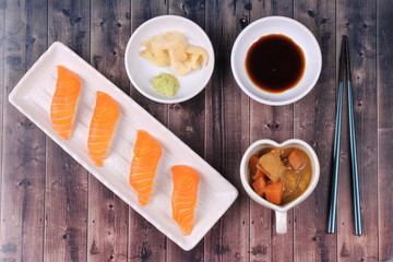 Salmon sushi and side dish served with Japanese yellow curry.