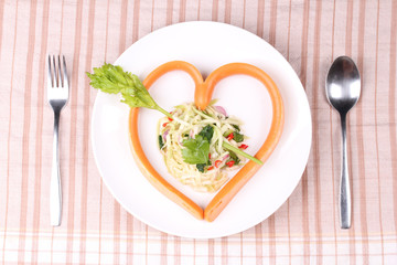 Sausage cheese in heart style with spicy green mango salad.