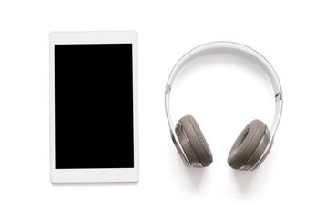 Headphones and tablet isolated on white