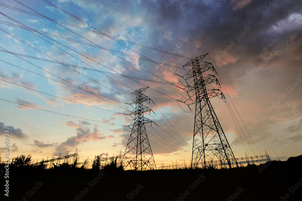 Wall mural electric towers over sunset