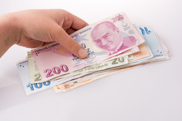 Hand holding Turksh Lira banknotes  in hand