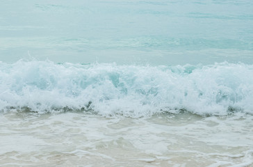 Splashing Waves from The Blue Sea  to The Clear White Sand Beach in Myanmar with Copyspace to input Text