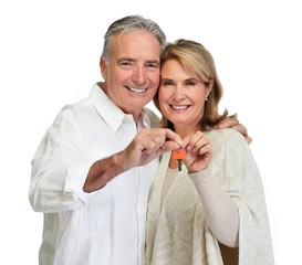 Senior couple with house key.