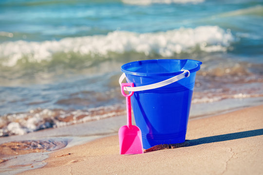 Child's sand pail and bucket at the beach