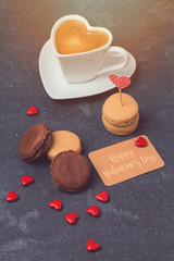 Valentines day concept with macarons over blackboard background