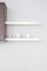 Fototapeta na wymiar Interior kitchen shelf with coffee cup