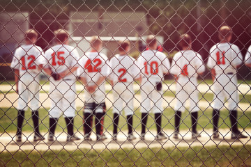 Blurred youth baseball background, children in a row at the begi