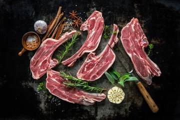 Gordijnen Raw fresh lamb meat on dark background © Alexander Raths