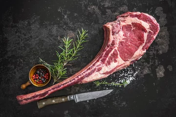 Fotobehang Dry aged raw tomahawk beef steak © Alexander Raths