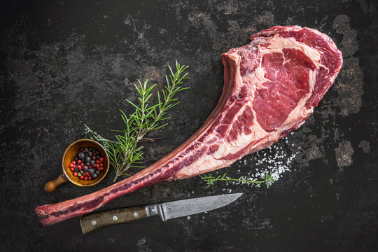 Dry aged raw tomahawk beef steak
