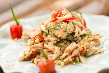 Chicken shreded mixed with sweet sour sauce.