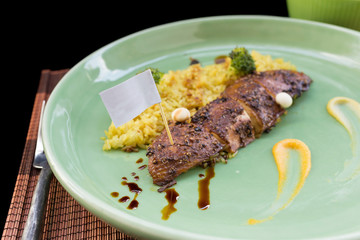 close up Chicken Biryani with green chutney.