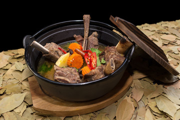 Beef short ribs with traditional chilli sauce, carrot, and potat