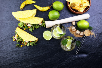 Caipirinha of Brazil, tacos and delicious nachos with melted che
