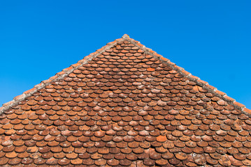 Old ceramic tile roof pointing upward