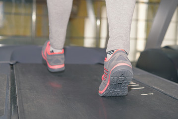 Fototapeta na wymiar girl on a treadmill